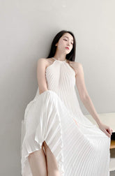 Halterneck Pleated Silk Midi Dress with Flowing A-Line Silhouette and Backless Detail